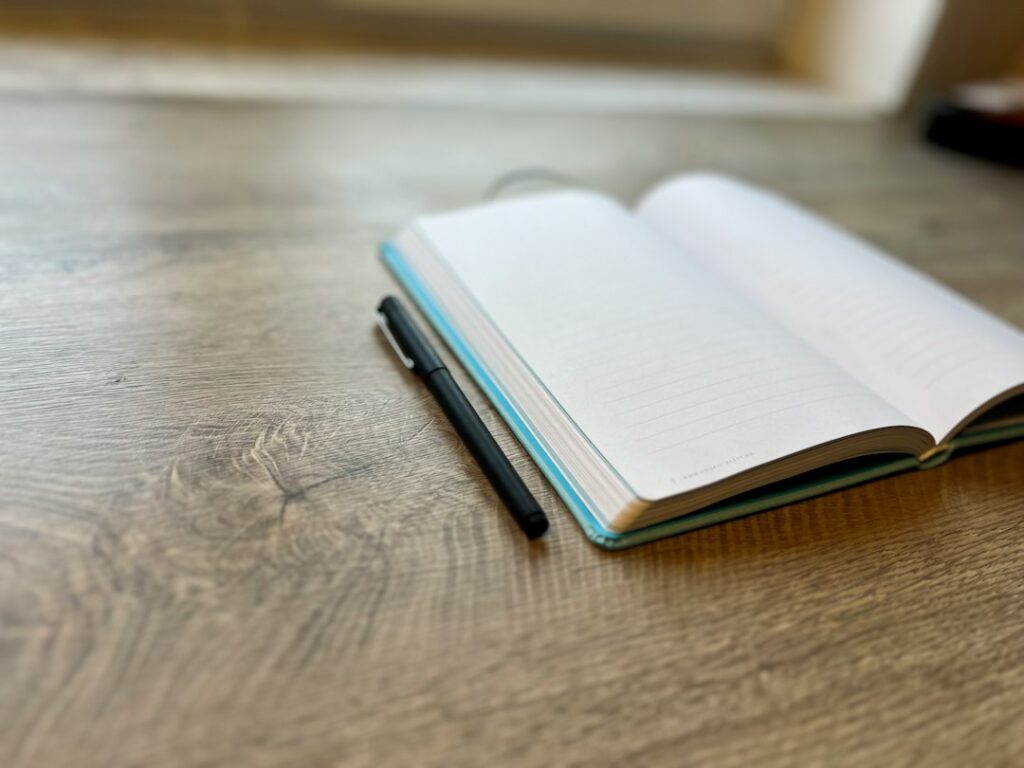 A pen resting on a book